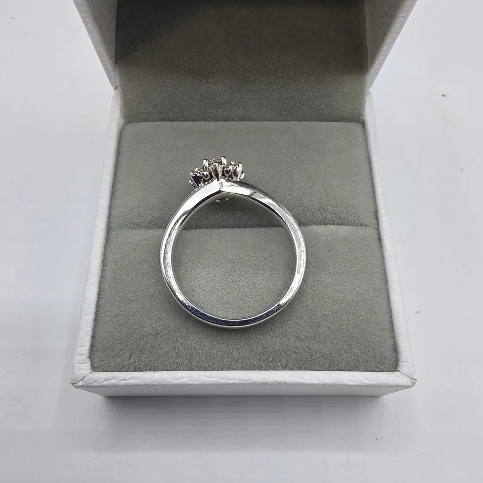 18CT WHITE GOLD RING SET WITH A NATURAL DIAMOND TO NATURAL DIAMOND HALO