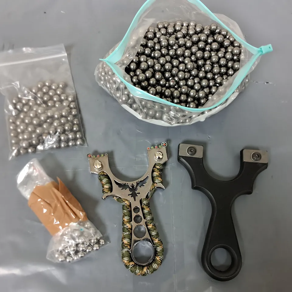 LOT OF METAL BALL BEARINGS AND TWO CATAPULTS 