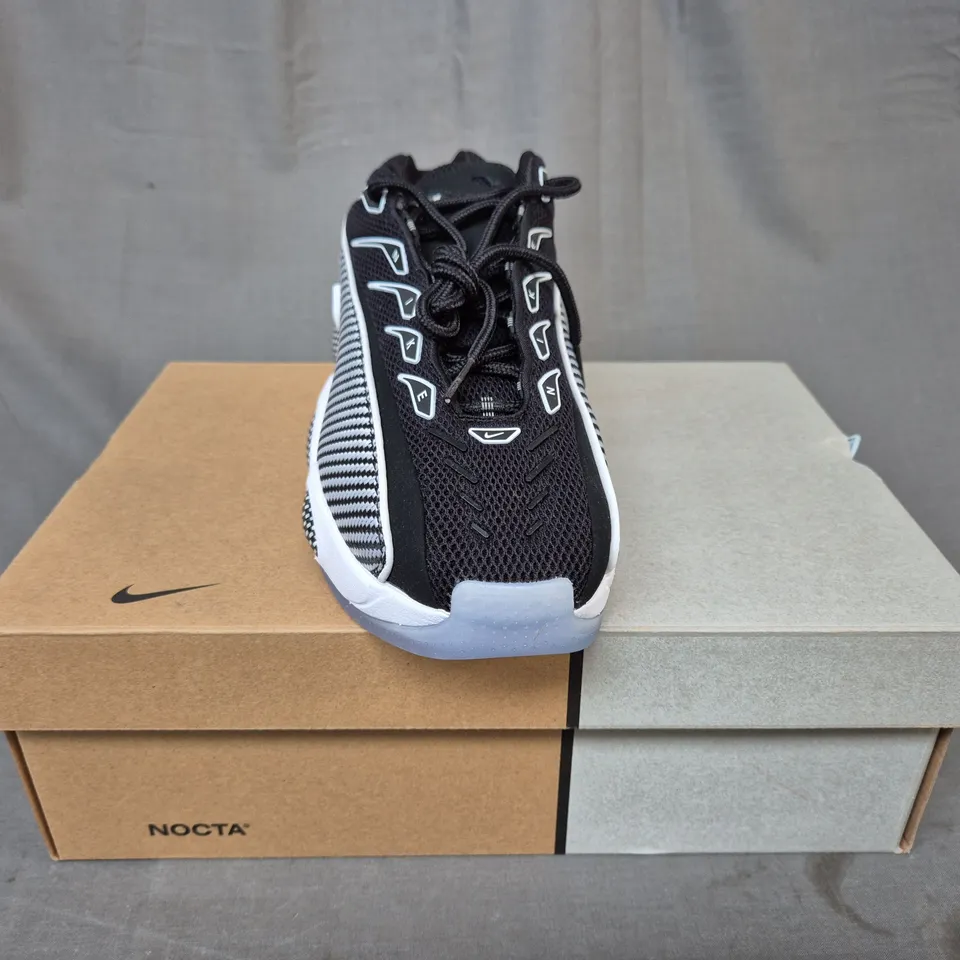 BOXED PAIR OF NIKE NOCTA GLIDE SHOES IN BLACK/WHITE UK SIZE 7