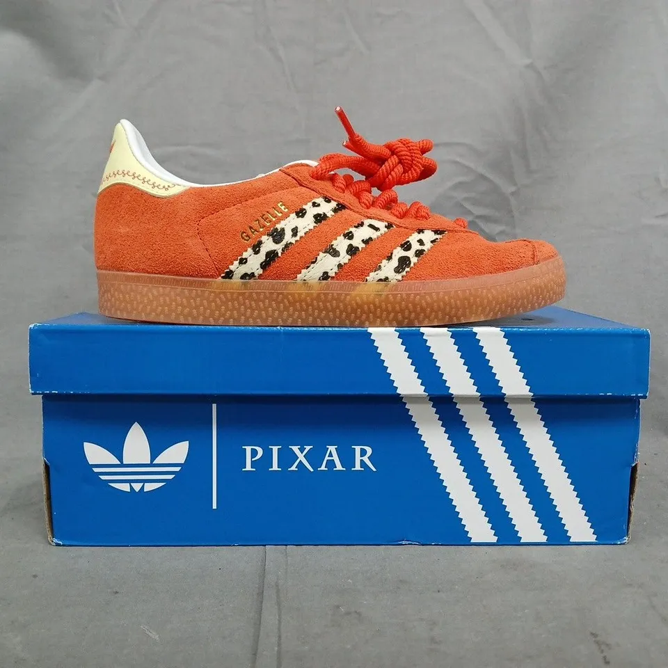 BOXED PAIR OF ADIDAS PIXAR GAZELLE SHOES IN ORANGE/MULTI SIZE UK 2