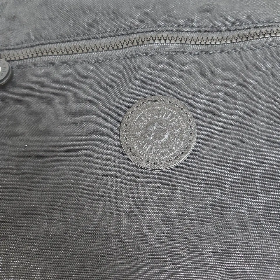 BLACK CROSSBODY BAG WITH POM-POM AND TRIPLE ZIP POCKETS