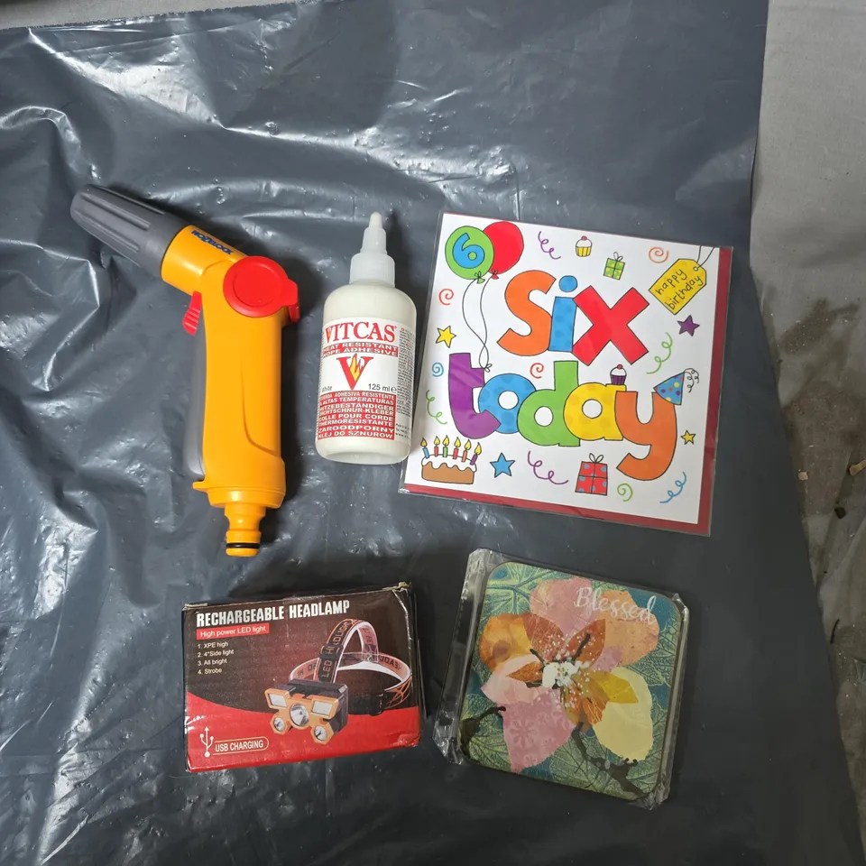 APPROXIMATELY 15 ASSORTED HOUSEHOLD ITEMS TO INCLUDE DRINKS MAT, BIRTHDAY CARD, ADHESIVE , HOSE NOZZLE & HEADLAMP
