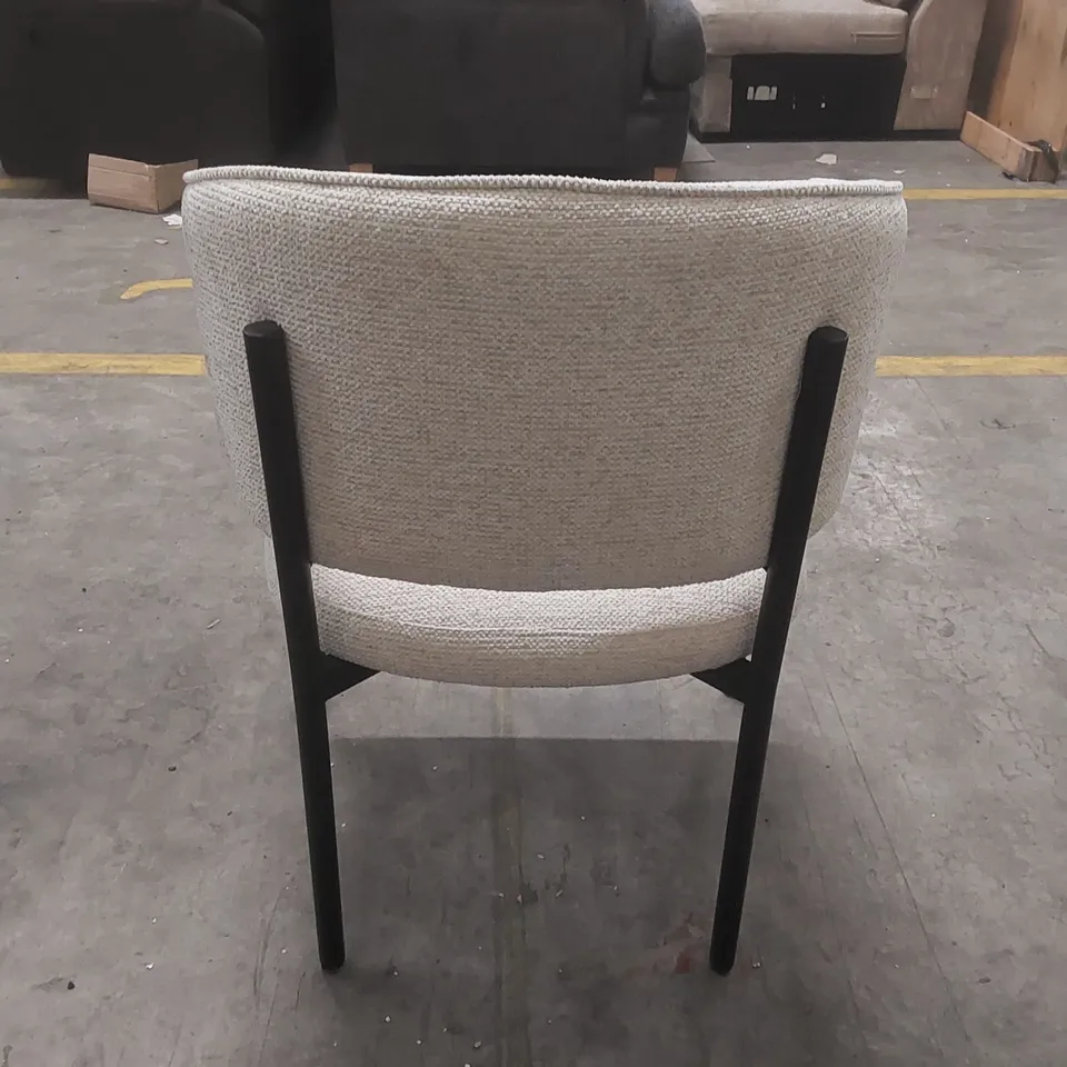 DESIGNER UPHOLSTERED ARMCHAIR WITH METAL BASE