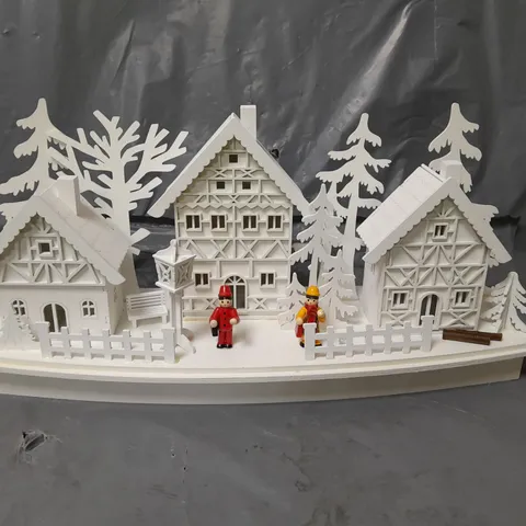 WHITE WOOD LIT VILLAGE SCENE