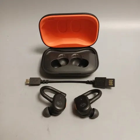 SKULLCANDY WIRELESS EARBUDS IN BLACK AND CORAL