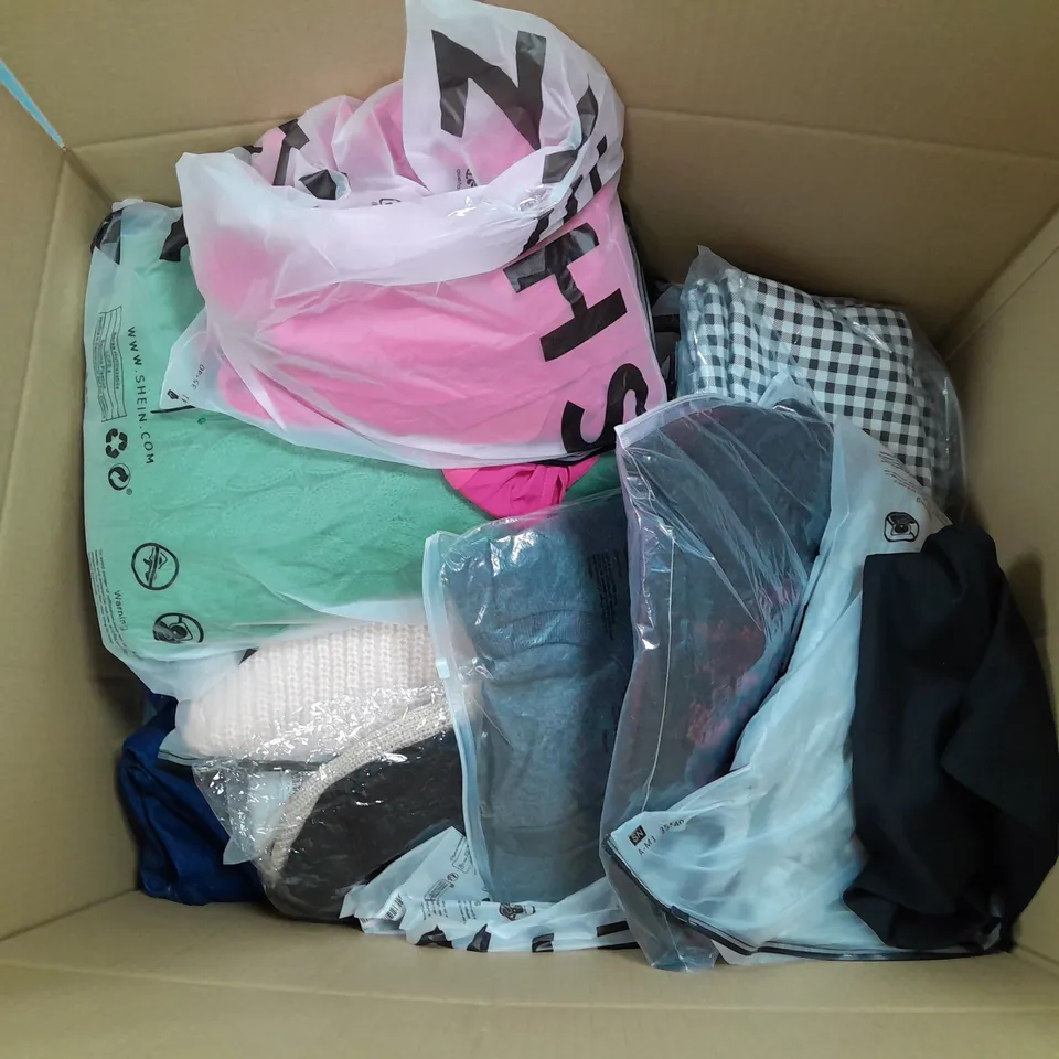 LARGE BOX OF ASSORTED CLOTHING ITEMS IN VARIOUS COLOURS AND SIZES INCLUDING TROUSERS , TOPS AND JUMPERS 