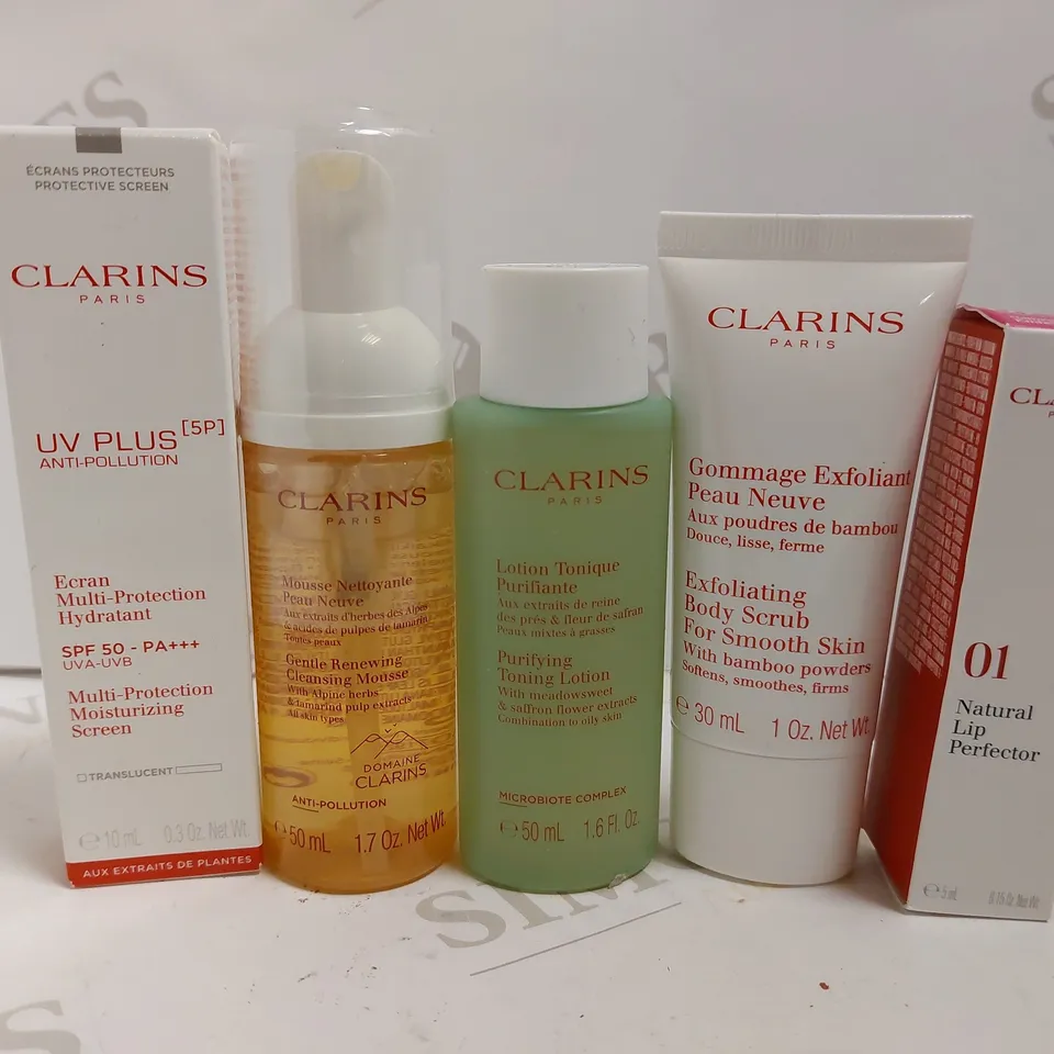 APPROX 5 CLARINS ITEMS TO INCLUDE BODY SCRUB. TONING LOTION AND CLEANSING MOUSSE