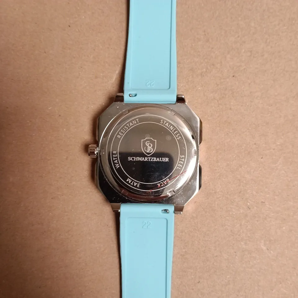 BOXED SCHWARTZBAUER WATCH – STAINLESS STEEL CASE, ROULETTE WHEEL/POKER DETAIL, TURQUOISE SILICONE STRAP