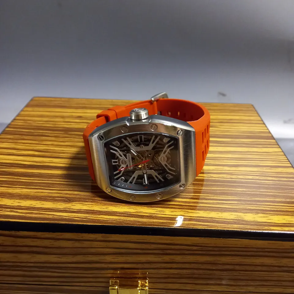 DESCHAMPS & CO MENS SILVER WATCH WITH SKELETON DIAL GLASS EXHIBITION BACK CASE AND RED RUBBER STRAP