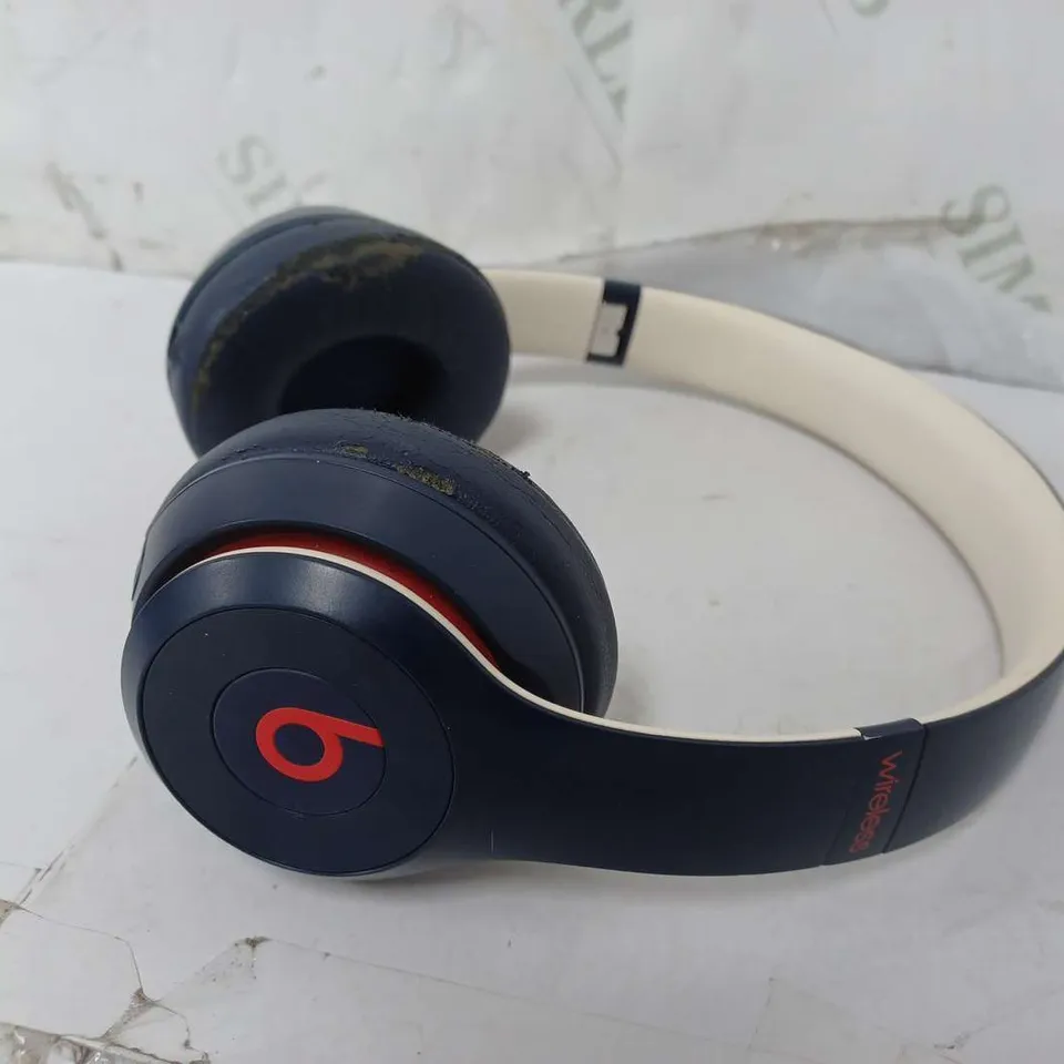 BEATS WIRELESS HEADPHONES IN NAVY/RED