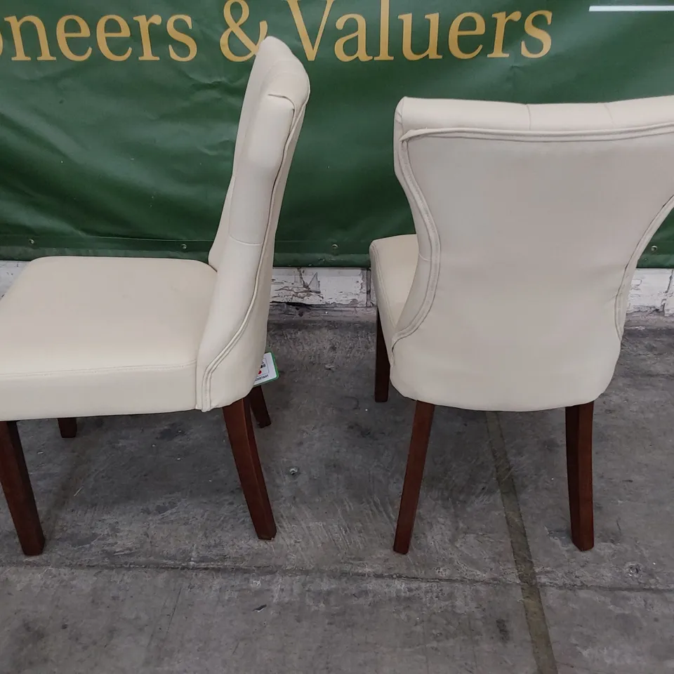 PAIR OF UPHOLSTERED BUTTONED BACK DINING CHAIRS CREAM PU ON DARK WOOD LEGS 