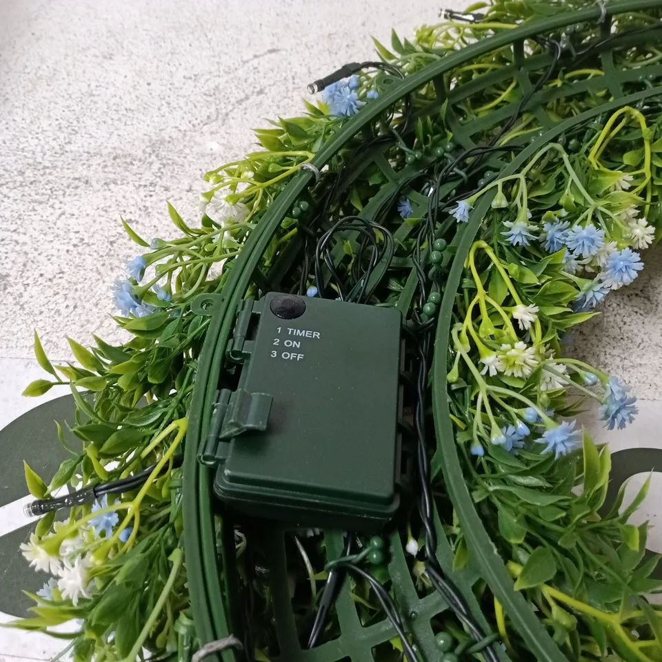 ARTIFICIAL FLORAL WREATH WITH INTEGRATED LED LIGHTS AND TIMER BOXED