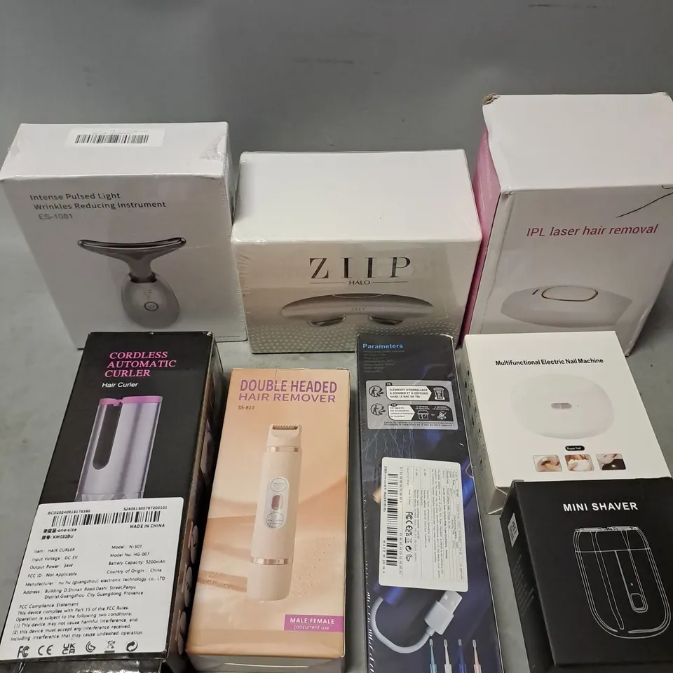 APPROXIMATELY 8 ASSORTED ELECTRICAL COSMETIC PRODUCTS TO INCLUDE - ZIIP HALO DEVICE - CORDLESS AUTOMATIC HAIR CURLER - WRINKLE REDUCING INSTRUMENT - ETC