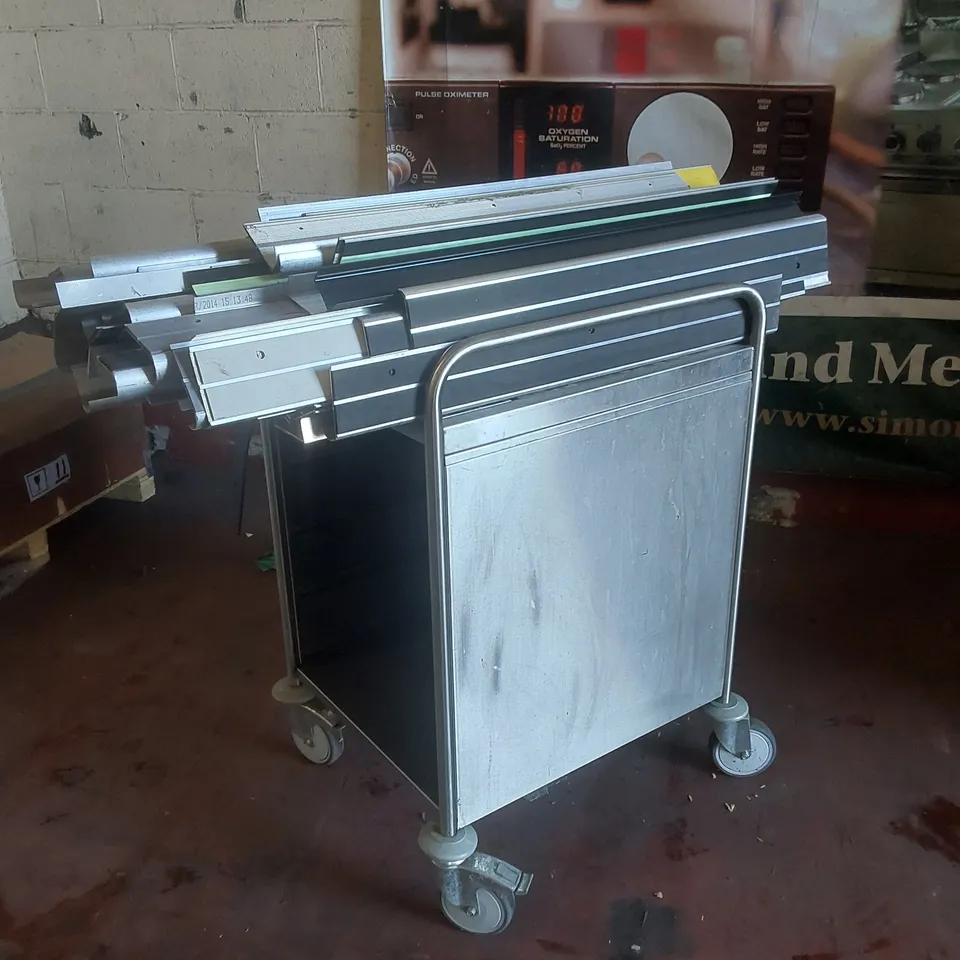 STAINLESS STEEL CATERING TROLLEY AND METAL TRIM PIECES