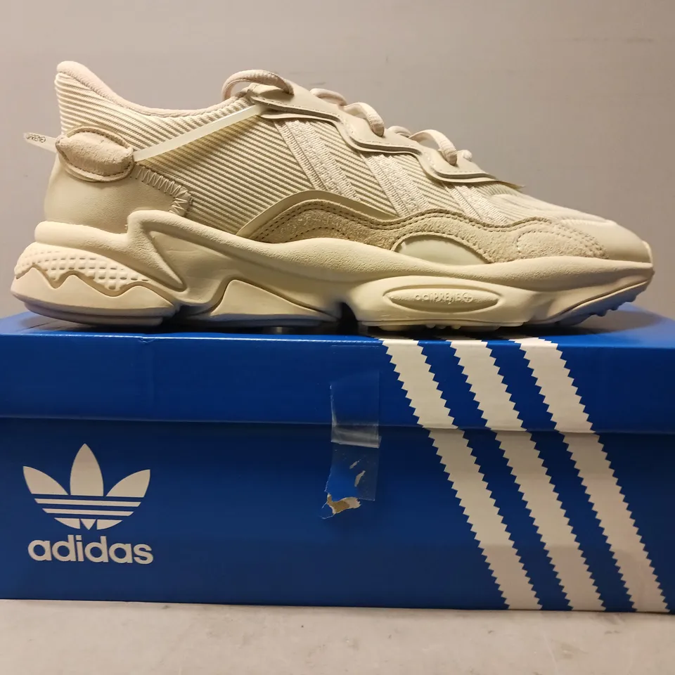 BOXED PAIR OF ADIDAS OZWEEGO SHOES IN BEIGE UK SIZE 9