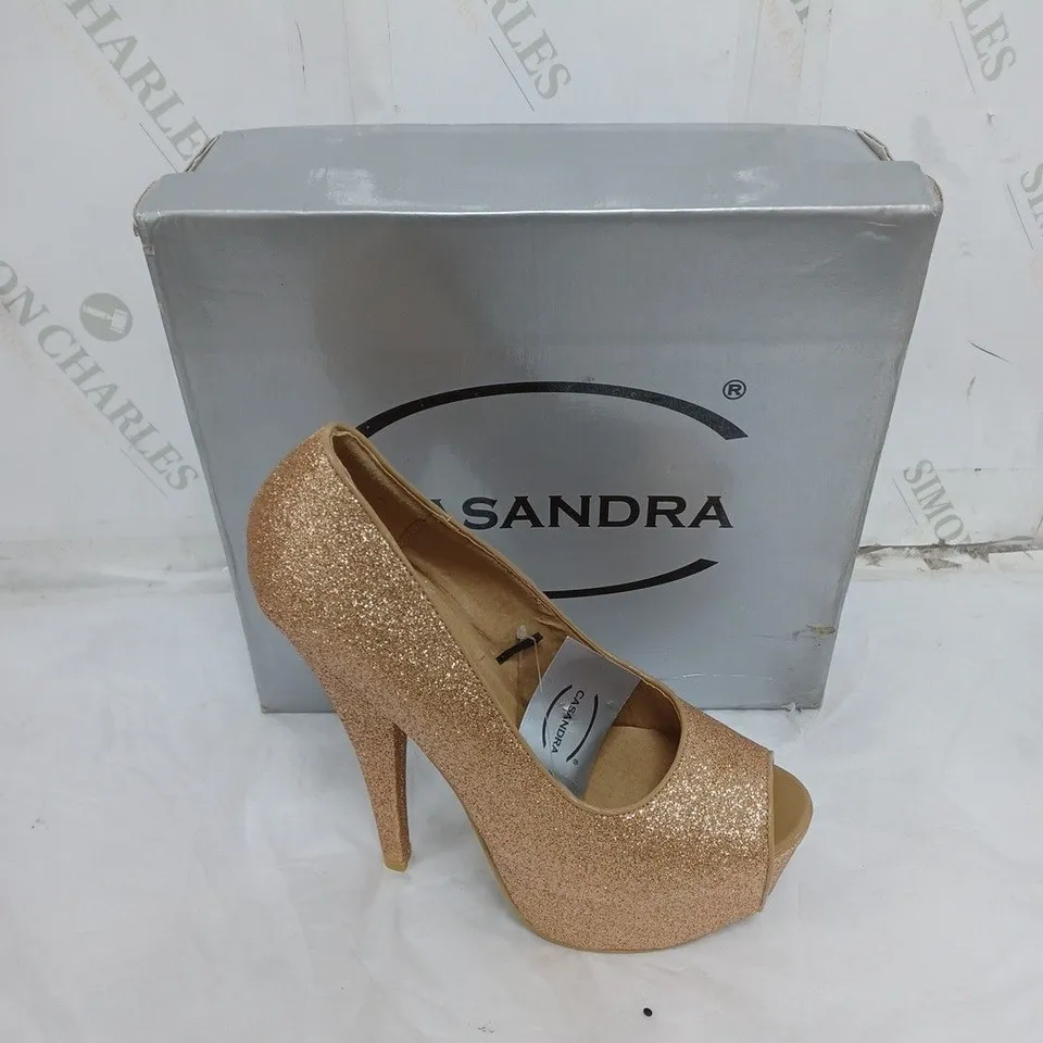 LARGE BOX OF BOXED APPROXIMATELY 10 CASSANDRA OPEN TOE HEELS IN GOLD GLITTER IN VARIOUS SIZES