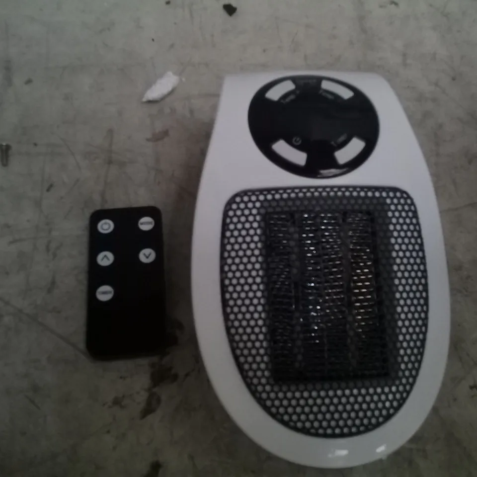 LOT OF 2 WARM HOME CERAMIC PLUG IN HEATERS
