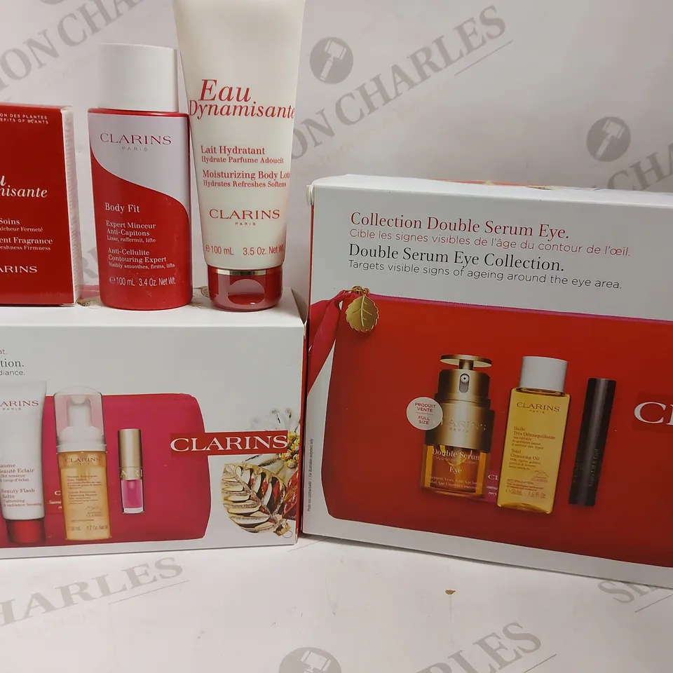 BOX OF APPROX 5 ITEMS TO INCLUDE CLARINS DOUBLE SERUM EYE COLLECTION, RADIANCE COLLECTION AND BODY FIT