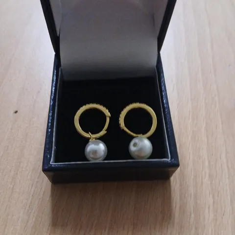 DIAMONIQUE 0.2CT SHELL PEARL HUGGIE EARRINGS STERLING SILVER