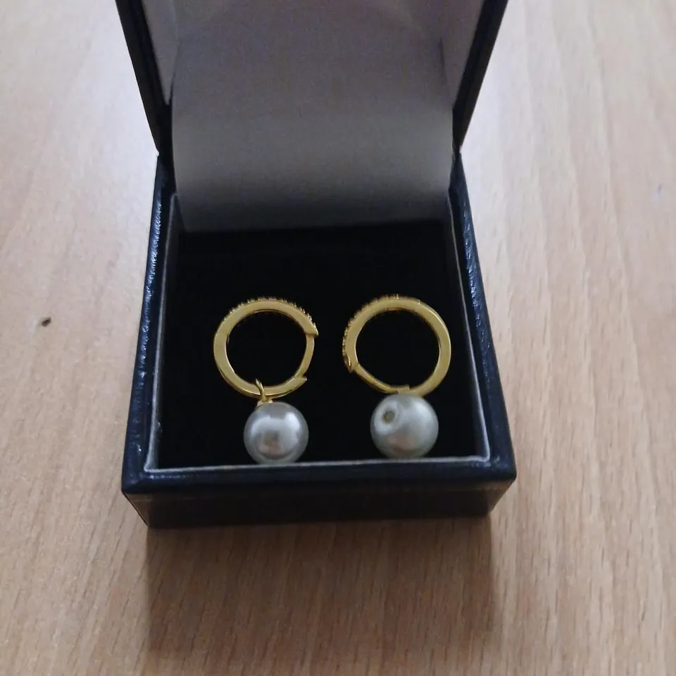 DIAMONIQUE 0.2CT SHELL PEARL HUGGIE EARRINGS STERLING SILVER