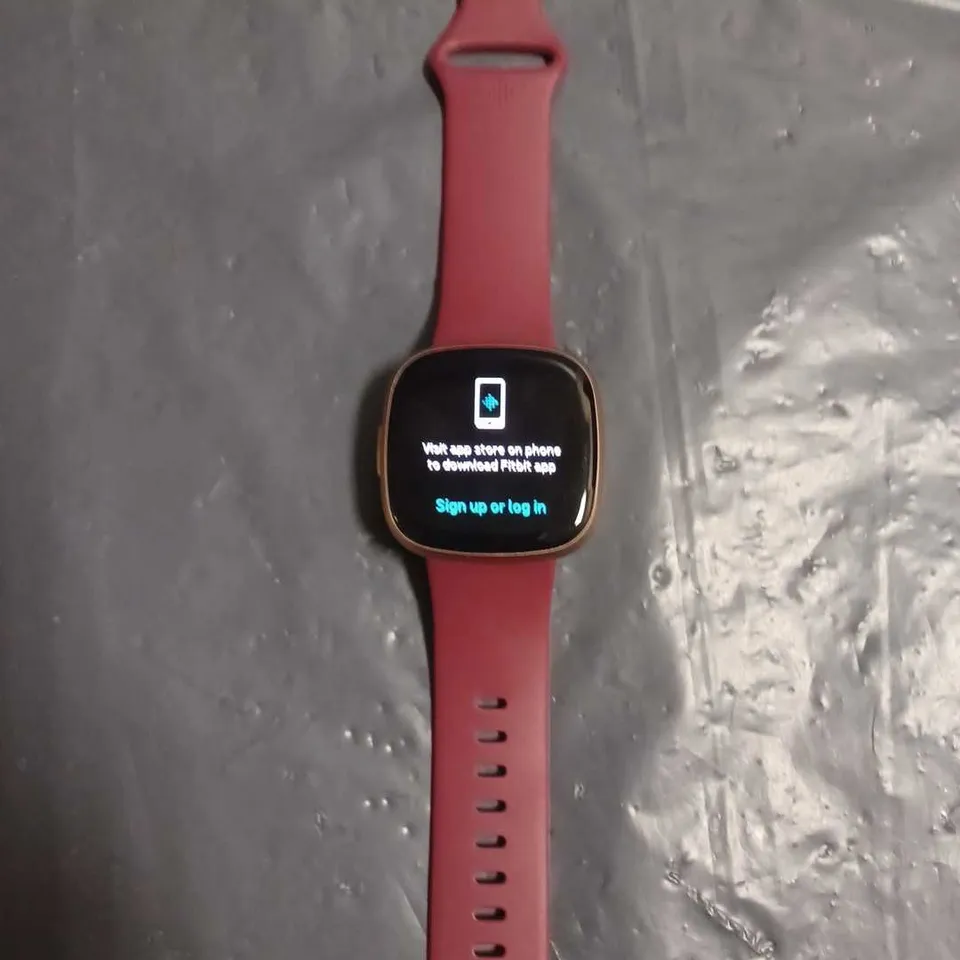 BOXED FITBIT VERSA 4 IN RED 