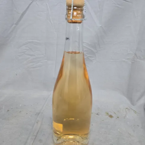 FOUR  BOTTLES OF PALE-GOLD SPARKLING DRINK