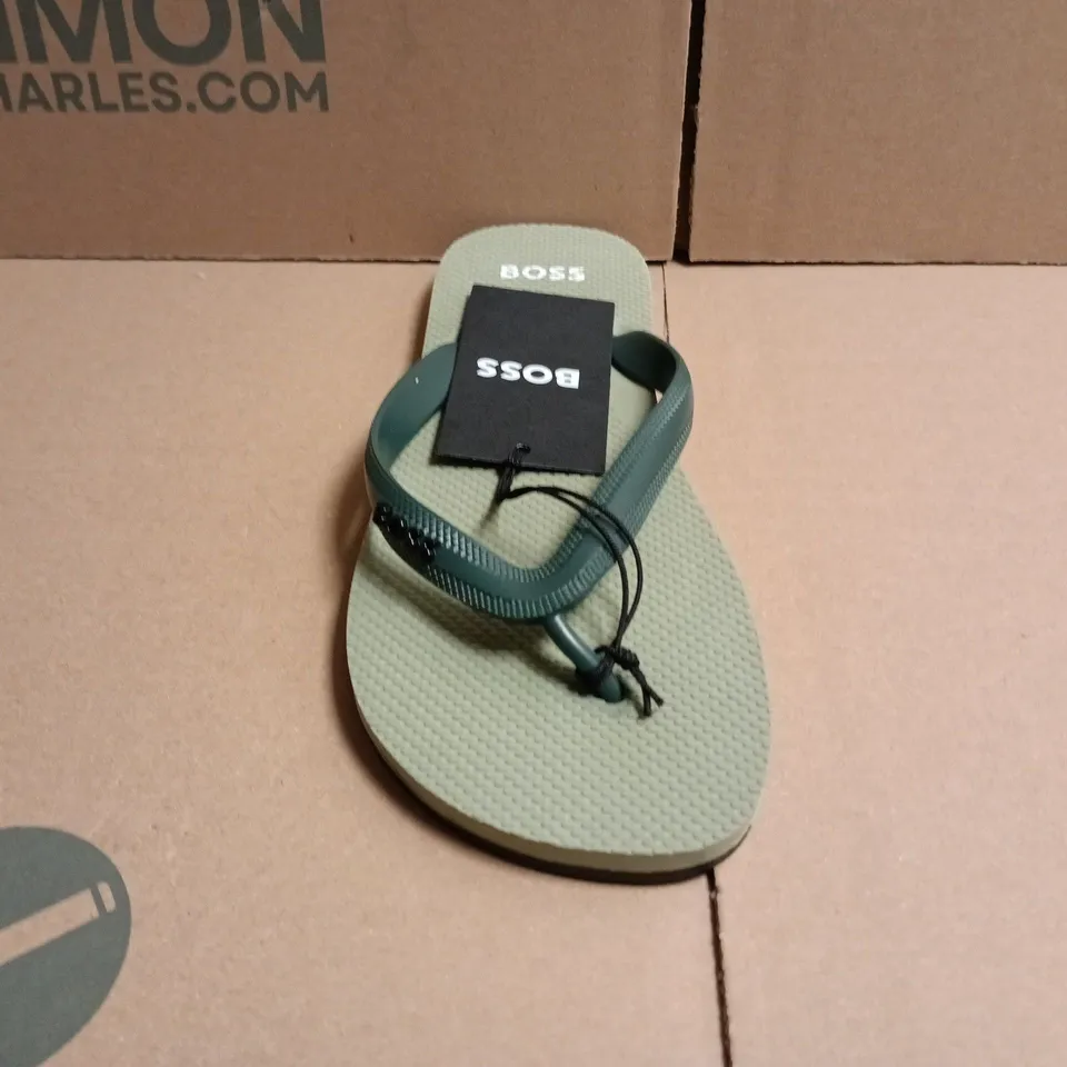 BOXED PAIR OF BOSS TRACY LOGO FLIP FLOPS IN LIGHT GREEN SIZE 7