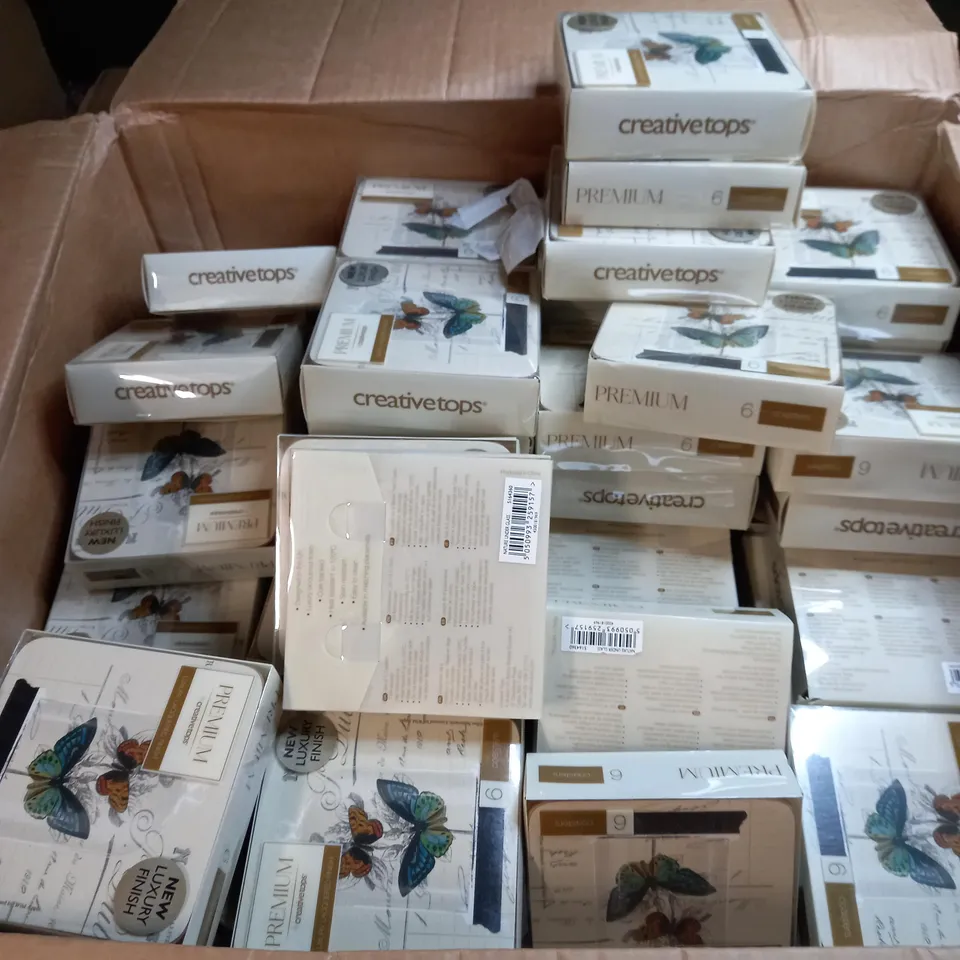 BOX OF APPROXIMATELY 70 PACKS OF CREATIVE TOPS CORK BACKED COASTERS IN A BUTTERFLY DESIGN 