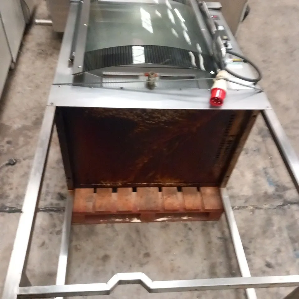 BKI ROTISSERIE OVEN ON METAL STAND