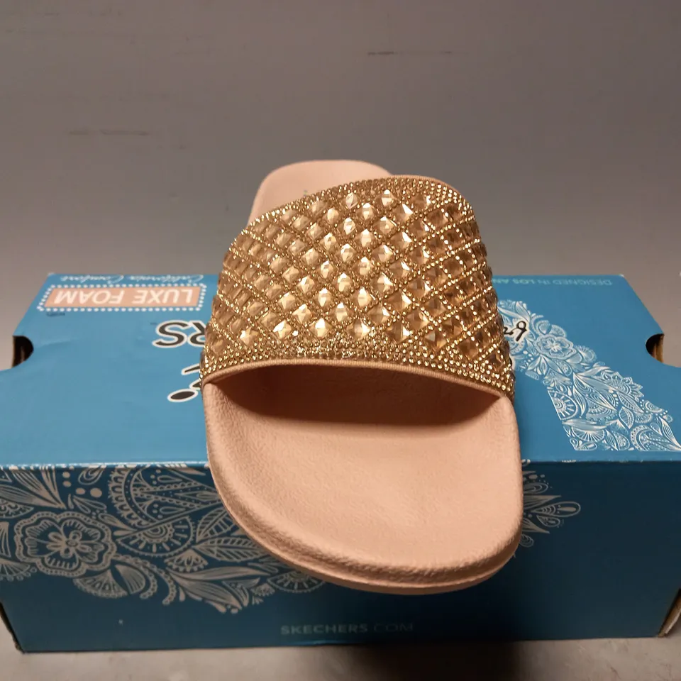 BOXED PAIR OF SKECHERS SANDALS IN ROSE GOLD SIZE 4