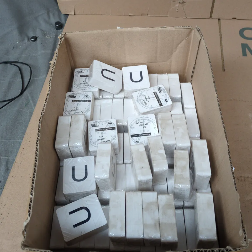 BOX OF APPROXIMATELY 130 BRAND NEW ACTIVE LITERACY KITS (SHORT WORD ENDINGS FLASH CARDS)