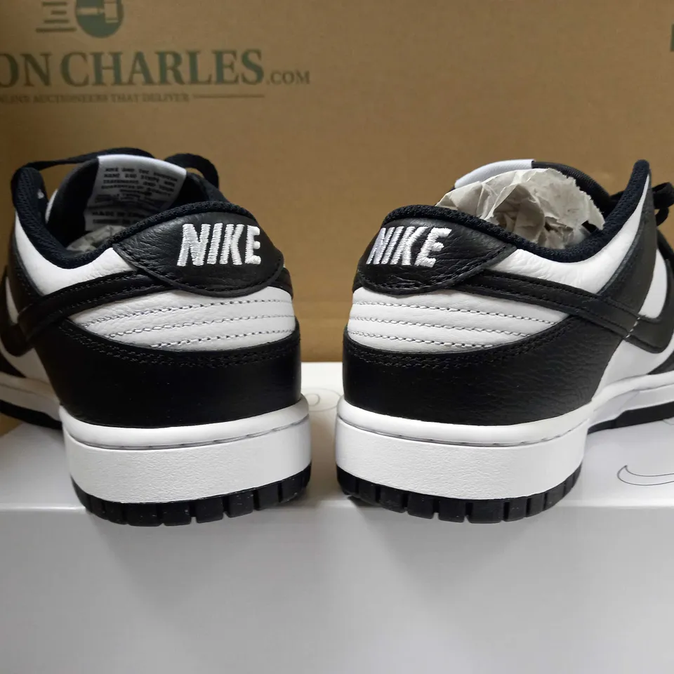 BOXED PAIR OF BLACK/WHITE LOGO NIKE TRAINERS - SIZE 8.5
