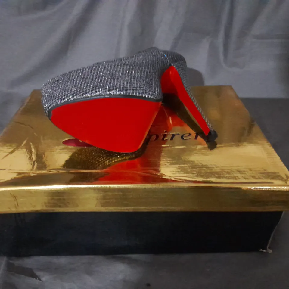 APPROXIMATELY 10 BOXED PAIRS OF SILVER HIGH HEEL BOOTS VARIOUS SIZES