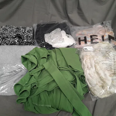 LARGE QAUNTIITY OF ASSORTED CLOTHES IN VARIOUS COLORS AND SIZES TO INCUDED DRESSES, T-SHIRTS , TROUSERS