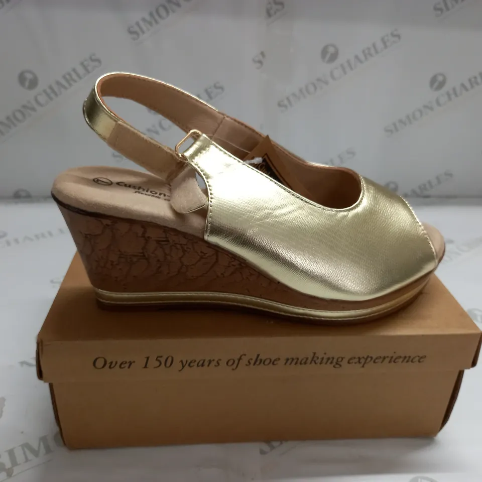 BOXED PAIR OF CUSHION WALK GOLD STRAPPY WEDGE HEELED SHOES - SIZE 7