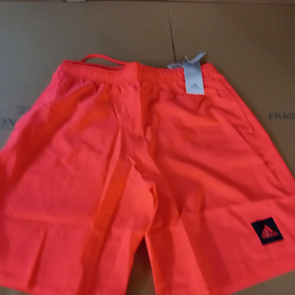 adidas solid shorts in orange - 
