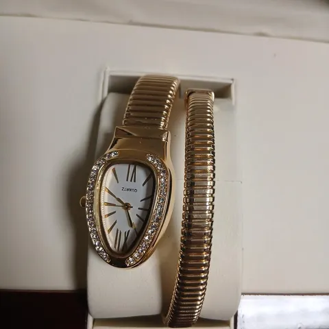 QUARTZ WATCH WITH STONE-SET BEZEL IN GOLD-TONE, BOXED