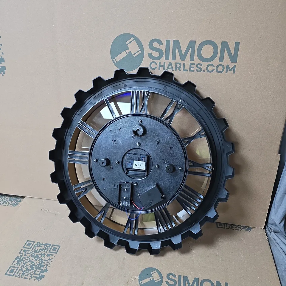 SKELETON GEAR WALL CLOCK – BLACK FRAME WITH GOLD ROMAN NUMERALS