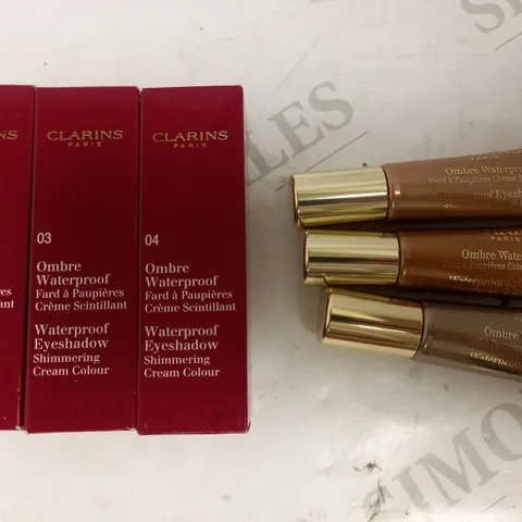 LOT OF APPROXIMATELY 38 CLARINS WATERPROOF EYESHADOW IN COPPER BROWN, SILVER TAUPE & GOLDEN PEACH