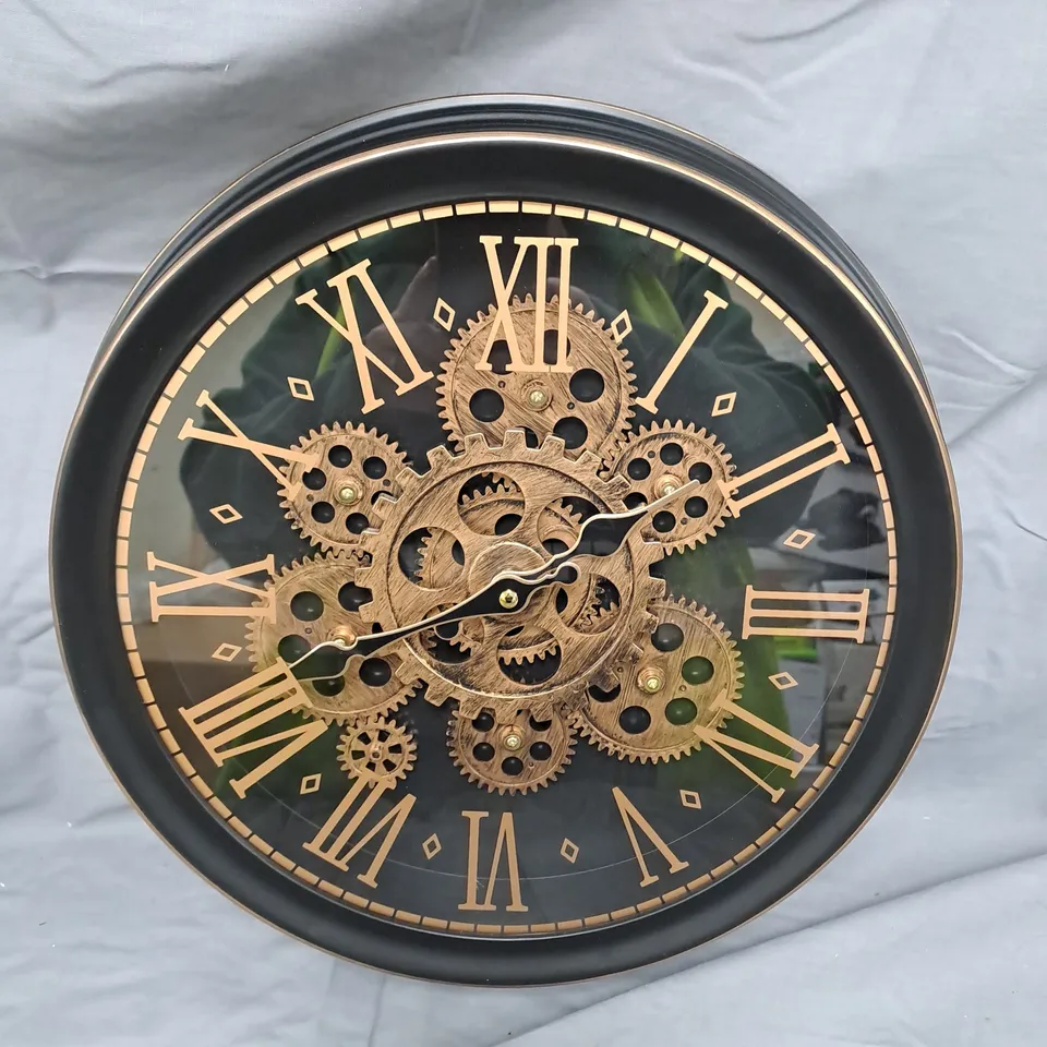 Round Skeleton Gear Wall Clock – Black Frame with Gold Roman Numerals