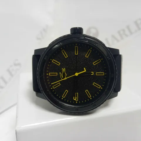 LACOSTE BLACK DIAL YELLOW ACCENT RUBBER STRAP WATCH