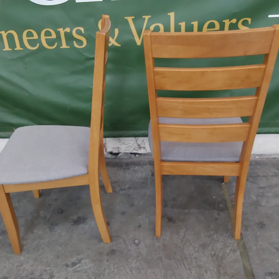 PAIR OF NATURAL WOOD DINING CHAIRS GREY FABRIC SEATS