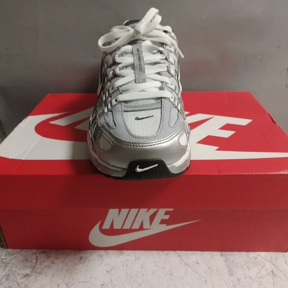 BOXED PAIR OF NIKE P-6000 TRAINERS IN METALLIC SILVER SIZE UK 9