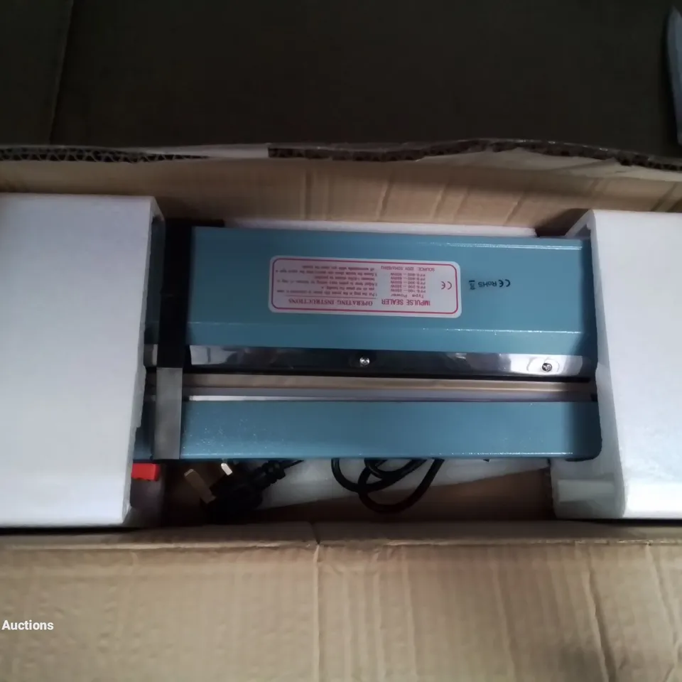 A BOXED IMPULSE SEALER 