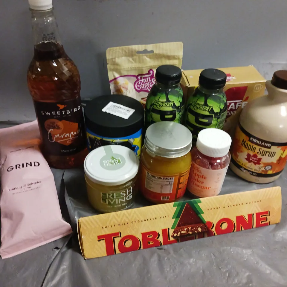 12 ASSORTED FOOD AND DRINK ITEMS TO INCLUDE SWEETBIRD CARAMEL CLASSIC SYRUP, PRIME DRINK, TOBLERONE, GRIND EDITIONS EL SLAVADOR GROUND - COLLECTION ONLY