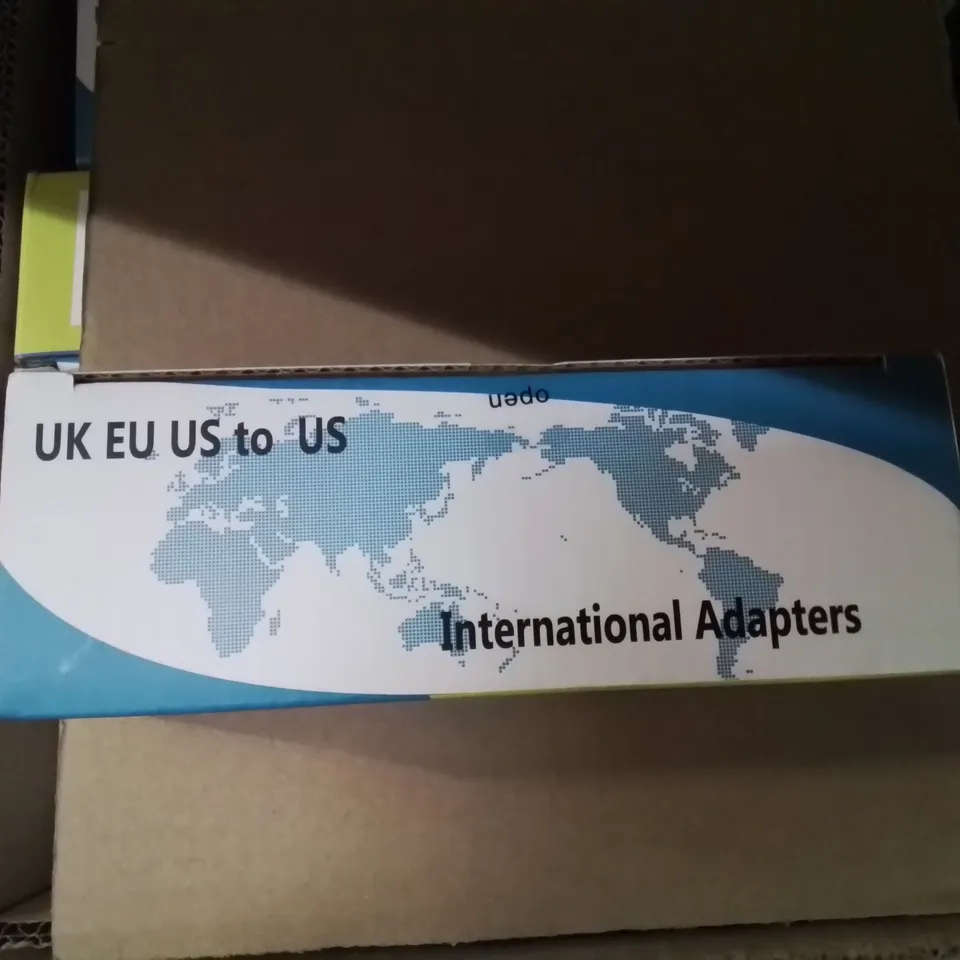 A BOX OF APPROXIMATELY 70 INTERNATIONAL ADAPTER PLUGS