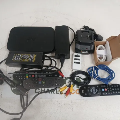 LOT OF ASSORTED HOUSEHOLD ITEMS TO INCLUDE ROUTERS AC/DC ADAPTER AND VARIOUS REMOTES