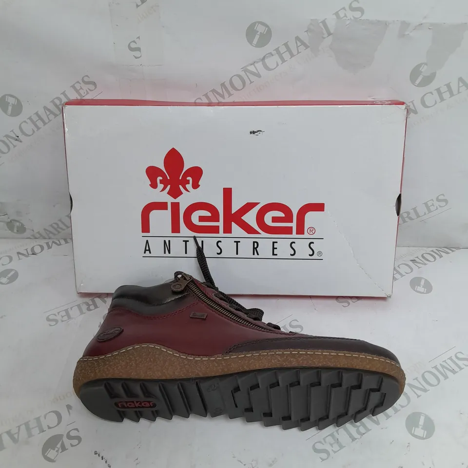 BOXED PAIR OF RIEKER SIDE ZIP WATER RESISTANT BOOTS IN BURGUNDY SIZE 8