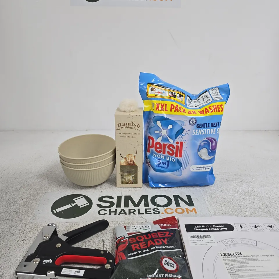 TOTE OF APPROXIMATELY 10 ASSORTED ITEMS INCLUDING PERSIL NON BIO 3IN1 CAPSULES, LESELUX LED RECHARGEABLE MOTION SENSOR CEILING LIGHT AND FJUKA SQUEEZE READY PELLETS