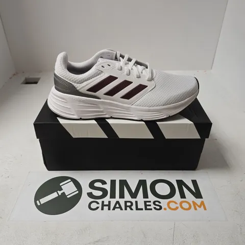 BOXED PAIR OF ADIDAS GALAXY 6 M TRAINERS IN WHITE - UK 9.5